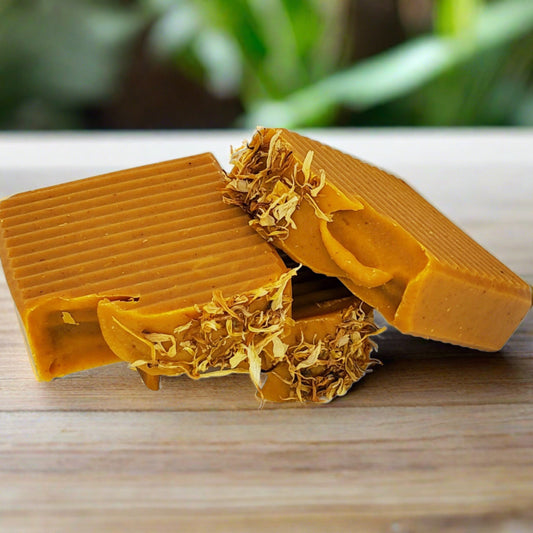 Natural Turmeric Soap Bar with orange-yellow color and exfoliating texture