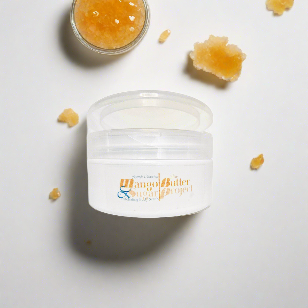 Image of open white flip-top jar of Mango & Sugar Exfoliating Body Scrub - Oat n Honey