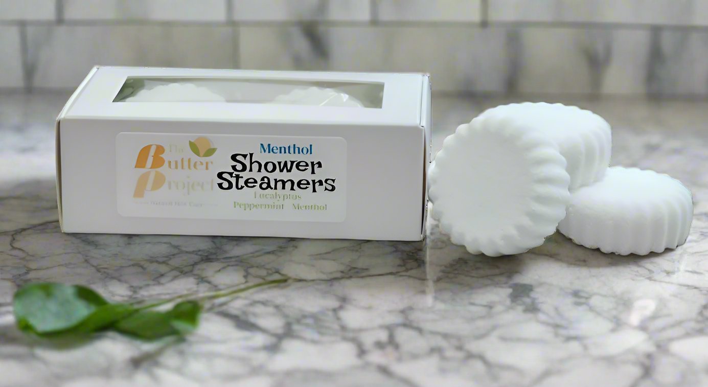 Image of box of menthol shower steamers with four unboxed shower steamers