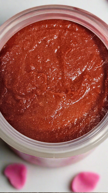 Top view image showing rose colored contents of an open jar of Mango & Sugar Exfoliating Body Scrub - Rose Kaolin