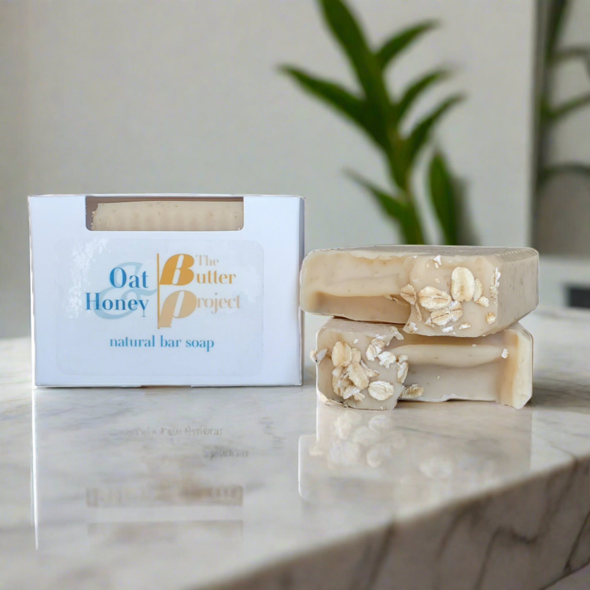 Image of Oat & Honey Natural Bar Soap Box and two Oat & Honey Natural Bar Soap from The Butter Project.
